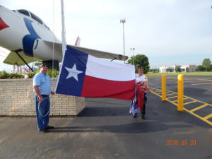 Members with Texas flag beside the F-84F