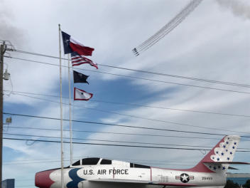 Jets fly overhead while F-84F stands guard at Post 490